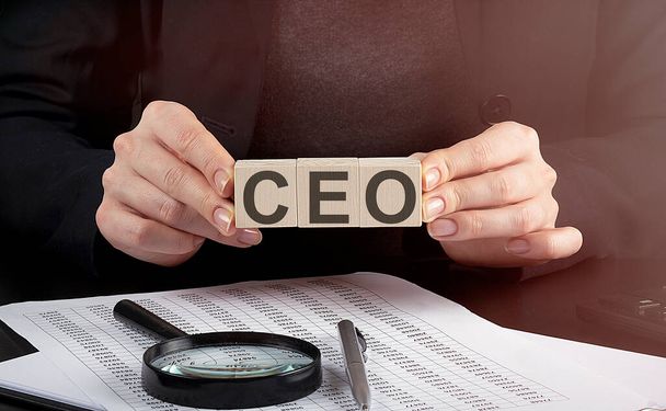 businesswoman holding wooden block with text CEO , business - Photo, Image