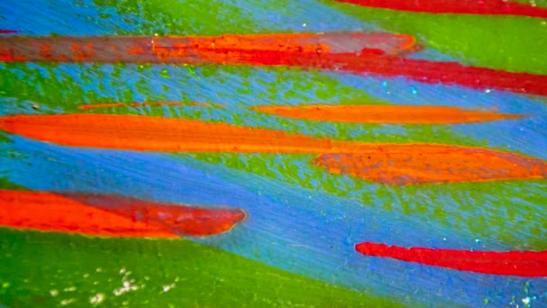 Veel verschillende gekleurde lijnen geschilderd heldere verf op doek close-up. - Video