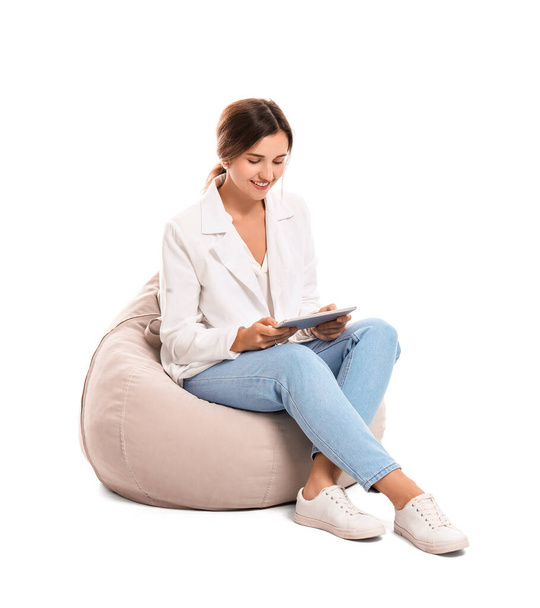 Young woman with tablet computer on white background - Foto, immagini
