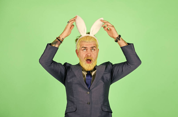 What a long ears. Bearded man touch bunny ears on head. Businessman wear bunny costume accessory. Bunny is symbol of Easter. Easter bunny or rabbit. Spring holidays celebration. Hippityhopping - Zdjęcie, obraz