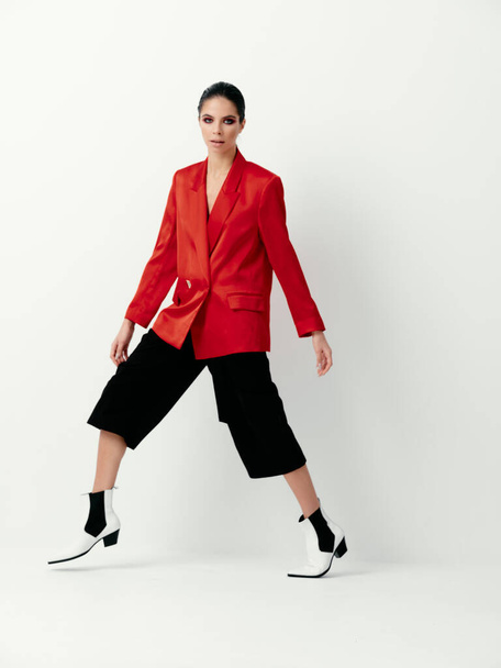 model in stylish clothes autumn red blazer pants boots - Photo, Image