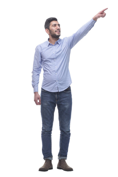 casual young man pointing at a white blank screen. - Foto, afbeelding