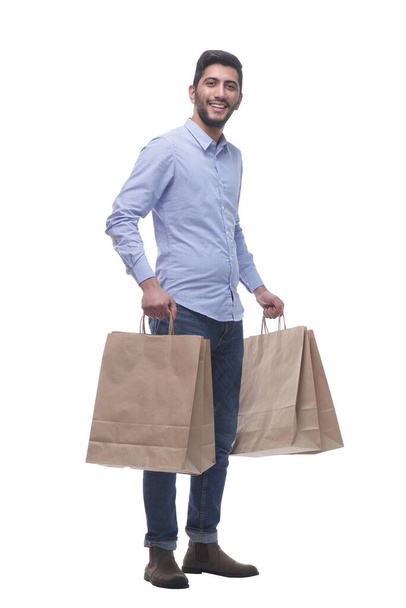 young man with large paper shopping bags . - Foto, immagini