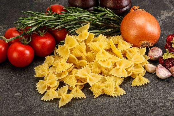 Raw Italian durum wheat farfalle pasta for cooking - Photo, Image