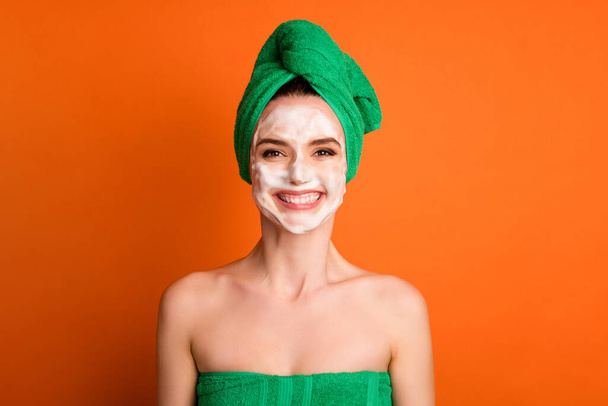 Photo of pretty funny woman smiling wear green turban head isolated orange color background - Foto, Bild