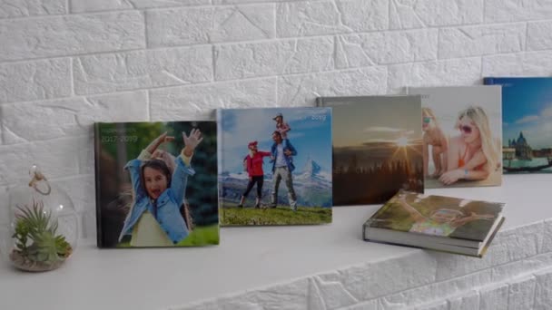 the photo album is decorated in a beautiful photobook. Presented on a white background - Footage, Video