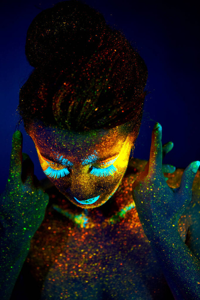 close up uv portrait glowing in a dark female model - Photo, Image