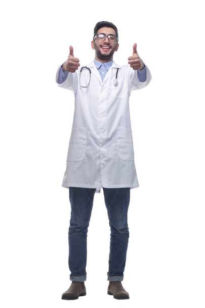 smiling doctor giving a thumbs up . isolated on a white background. - Фото, зображення