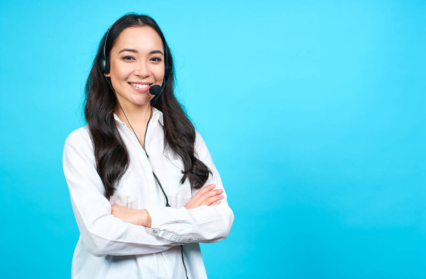 Portrait of Asian beautiful smiling woman customer support phone operator in office space banner background and copy space.Concept call center job service. Helping, answering, consulting. Copy space. - Foto, imagen