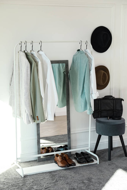 Rack with stylish clothes in modern dressing room - Photo, image