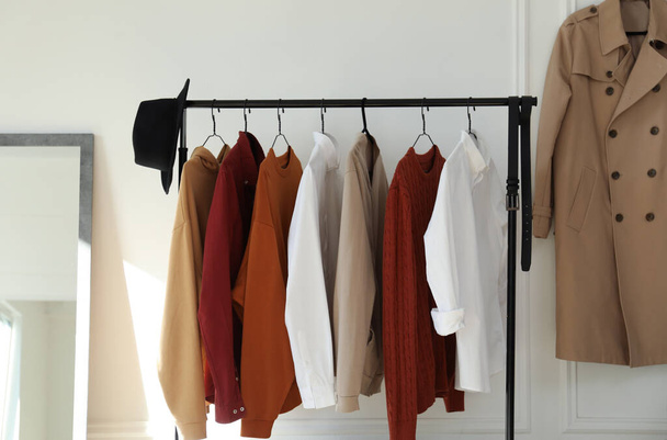 Rack with stylish clothes indoors. Interior design - Фото, зображення