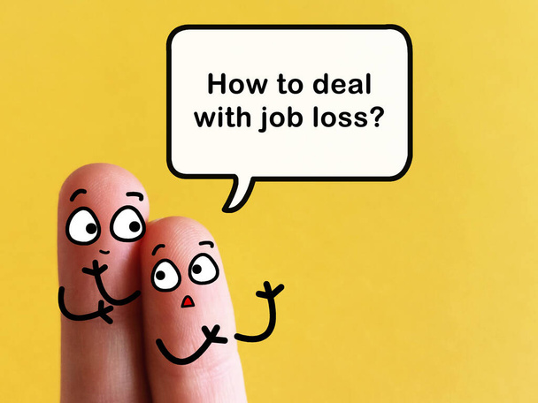 Two fingers are decorated as two person. One of them is asking how to deal with job loss. - Photo, Image