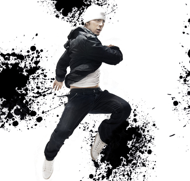 Hip Hop dancer jumping, over abstract splash background - Photo, image