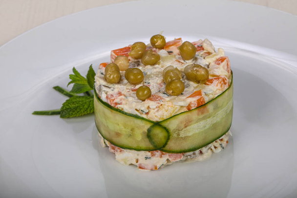 Traditional Russian salad Olivier with meat and peas - Photo, Image