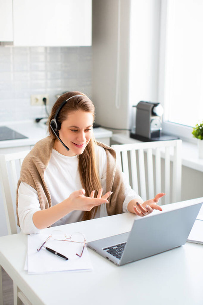 View of a young woman having online video-call. Remote working. - Photo, Image
