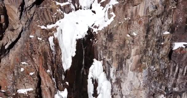 Freezing waterfall in the snowy mountains. - Footage, Video