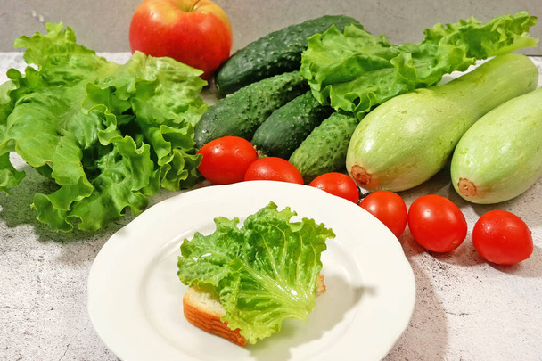 fresh salmon fish with green lettuce and vegetables, fresh salad with greens, raw food diet, closeup - Photo, Image