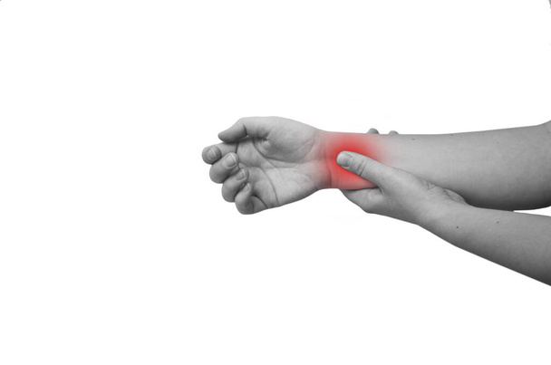 A woman s wrist hurts. A damaged female hand hurts. Hands suffer from work, sports injury. Sore spot is highlighted in red. Isolated white background. Black and white photo. - Fotografie, Obrázek