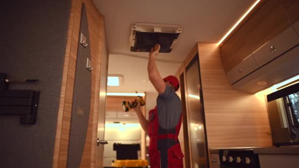 Finishing Installation of Brand New Air Condition Roof Mount Unit Inside Motorhome  - Footage, Video