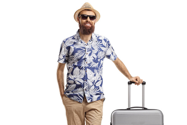 Male tourist posing with a suitcase isolated on white background - Photo, Image