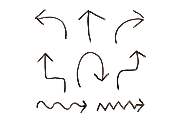Set van zwarte handtekening in meervoudige vorm van pijl symbool op witte achtergrond - Foto, afbeelding