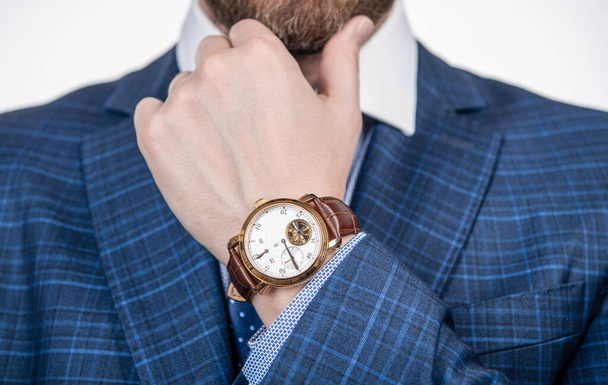 Class is timeless. Wristwatch worn on male arm wrist. Business wristwatch collection. Time management. Deadline and punctuality. Fashion accessory. Attention to detail. - Фото, изображение