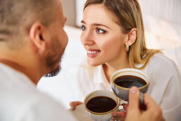 Romantic Caucasian couple enjoying their coffee break - Foto, Imagen