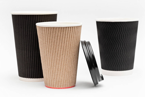 three empty cardboard cups for drinks on a white background - Photo, Image