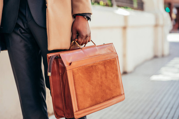 Business man holding a briefcase. - 写真・画像
