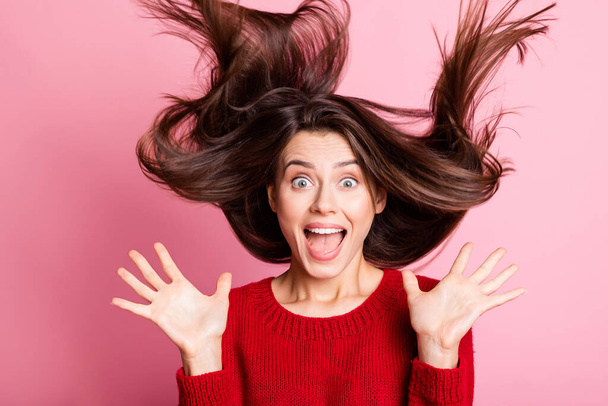 Photo of lovely lady open mouth hands look camera air hairdo wear red sweater isolated pink color background - 写真・画像