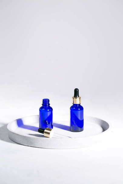 Blue dropper bottles on the white background - Photo, Image