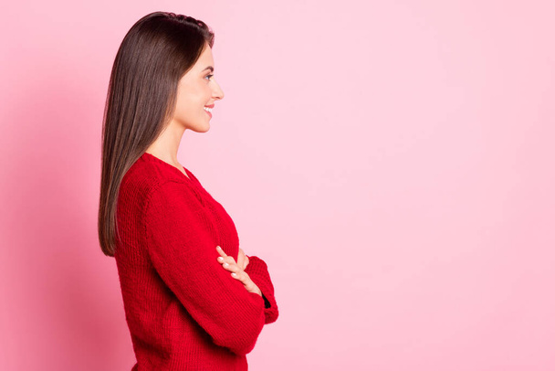 Profile photo of cute lady crossed hands beaming smile look empty space wear red pullover isolated pink color background - Fotó, kép