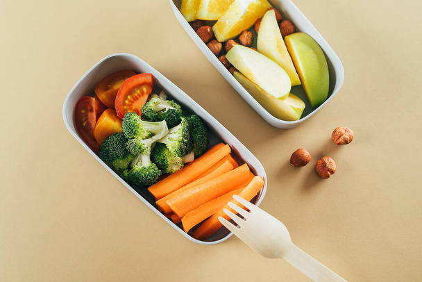 Lunch boxes with vegetables and fruits. Delicious balanced food concept. Healthy living concept - 写真・画像