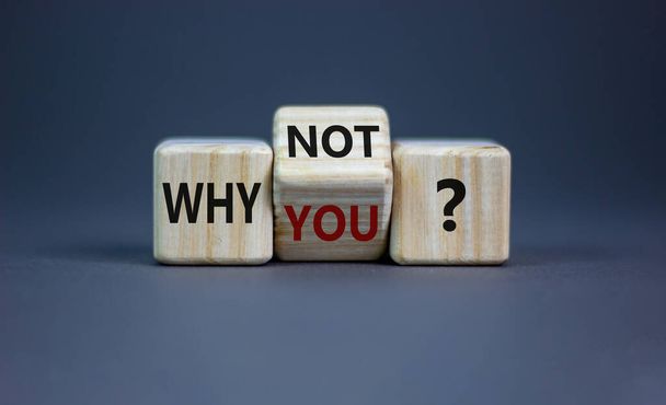 Why not you symbol. Turned a cube and changed words why you to why not. Beautiful grey background. Business and why not you concept. Copy space. - Photo, image