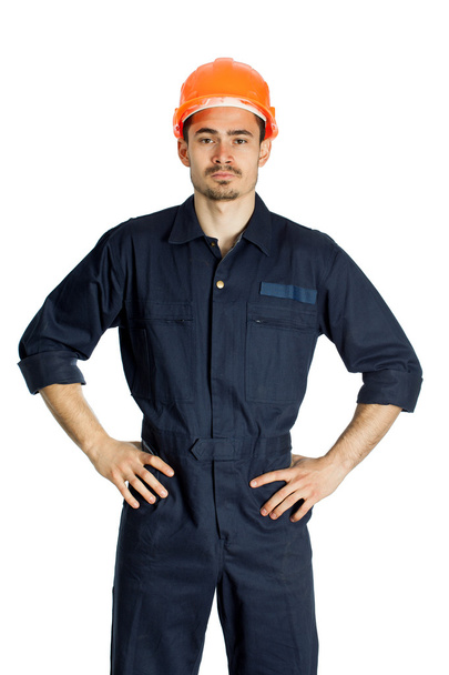 Funny worker in helmet with emotion on her face - Photo, Image