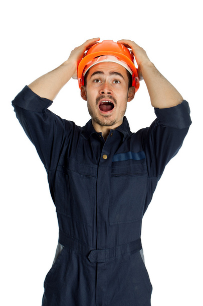 Funny worker in helmet with emotion on her face - Foto, afbeelding