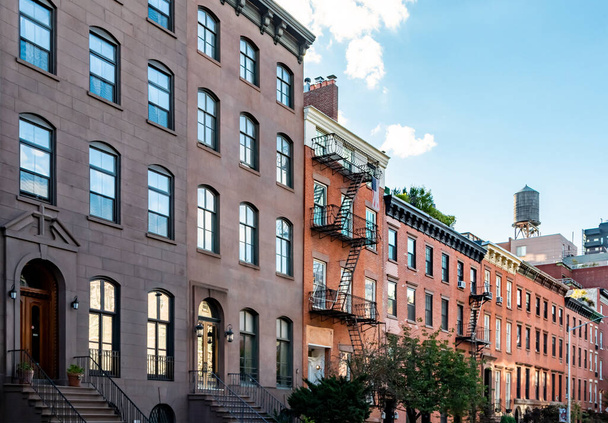 Block of old historic brownstone buildings in the Chelsea neighborhood of Manhattan in New York City NYC - Photo, Image