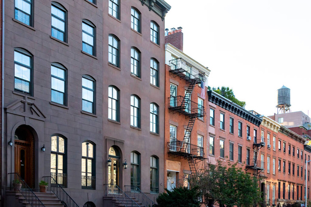 Block of old historic brownstone buildings in the Chelsea neighborhood of Manhattan in New York City NYC - Zdjęcie, obraz
