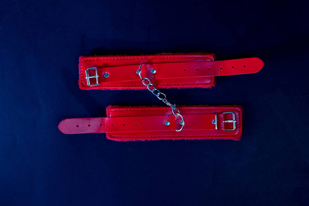 Sex Toy Bottom For Bdsm With Red Handcuffs - Φωτογραφία, εικόνα