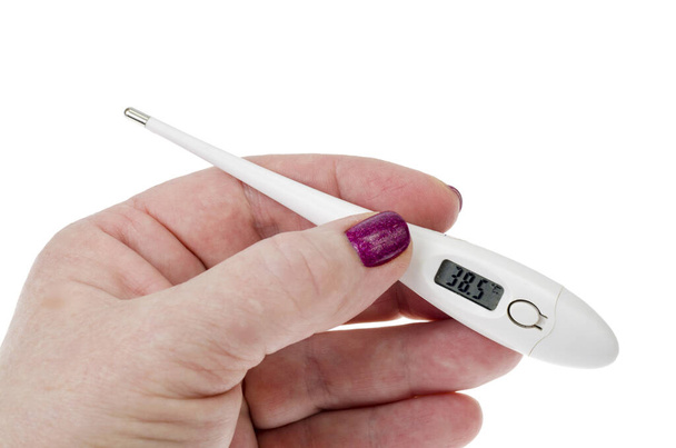 Жіноча рука з електронним термометром ізольована на білому тлі. Студія Фото
 - Фото, зображення