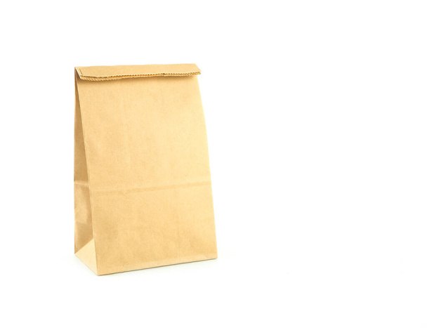 Brown kraft paper bag isolated on a white background - Photo, Image