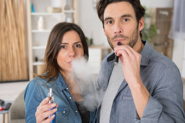 a couple is vaping together - 写真・画像