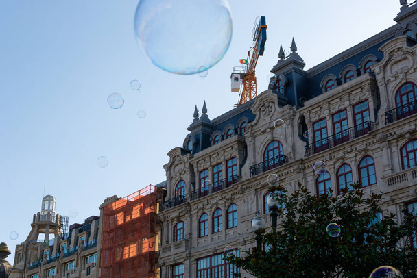 Soap bubbles and Aliados Avenue in Porto city on the background - Fotografie, Obrázek