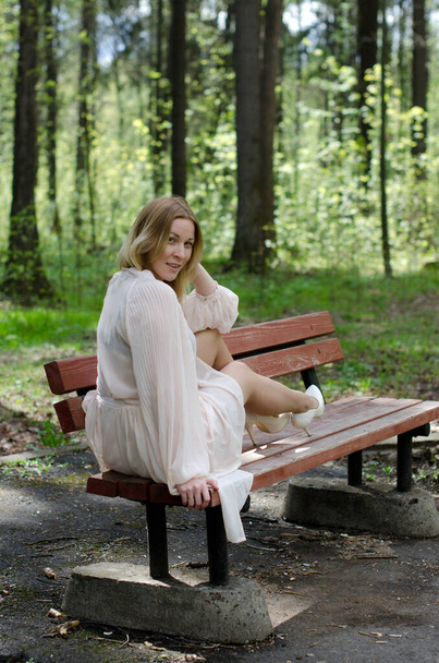 young girl in the park with a book - Valokuva, kuva