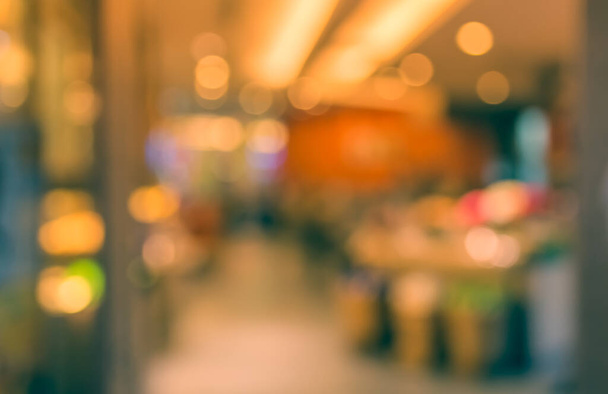 Imagen de Abstract Blur Retail Shop con luz bokeh para uso en segundo plano. (tono vintage) - Foto, imagen