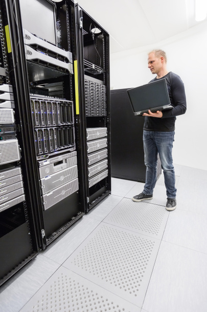 It engineer monitor systems in datacenter - Photo, Image