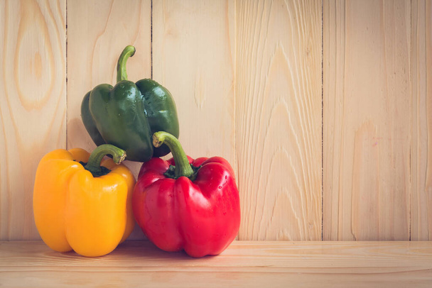 image of sweet peppers on wooden table background. - Photo, Image