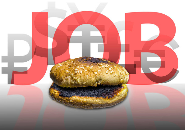 Contexto conceptual del desempleo. Un bollo de hamburguesa en el fondo de la inscripción JOB y símbolos de las monedas del mundo. Búsqueda de trabajo. Pérdida de medios de subsistencia - Foto, Imagen