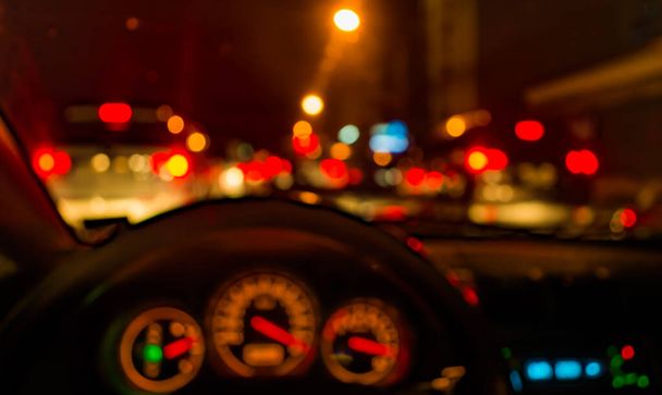blur image of inside car with bokeh lights with  on night time for background usage. - 写真・画像