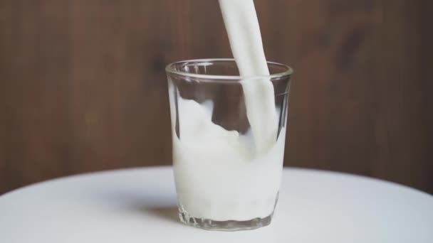 Milk poured into a glass. - Footage, Video